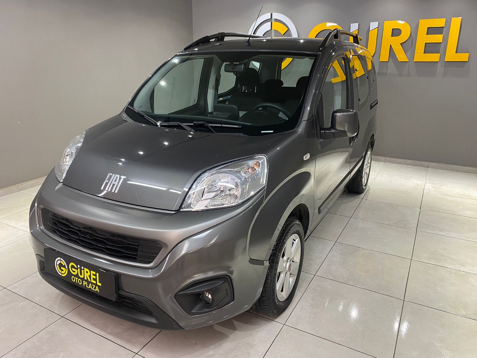TaksitliOto.Net | 2.El Fiat Fiorino Combi 1.4 Eko Safeline | Manuel & Benzin + LPG | Gri | İzmir.2el 2023 Benzin + LPG Manuel Fiat Fiorino Gri Gürel Tasarım Aksesuar Otomotiv San. Tic. Ltd. Şti.