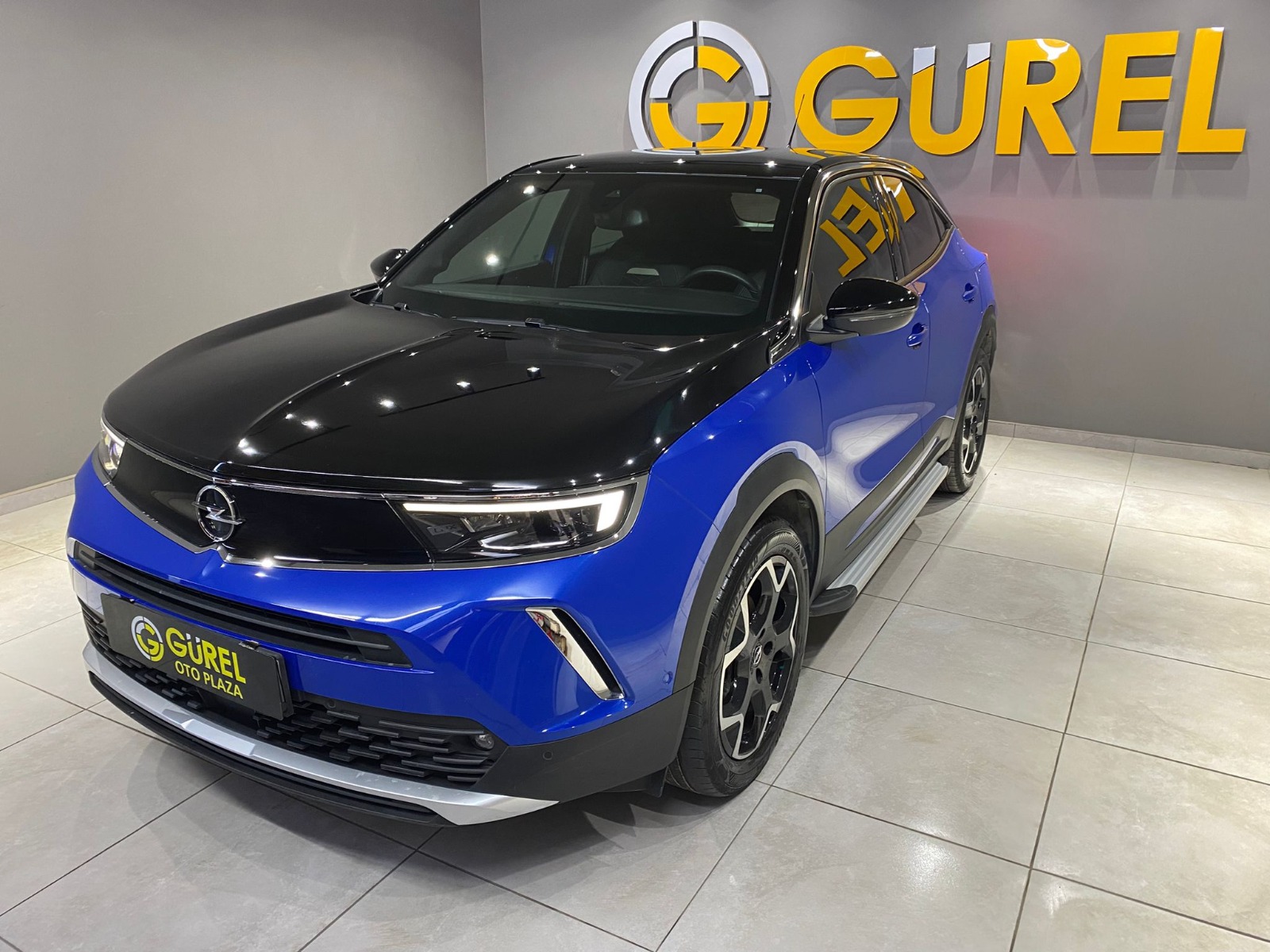 TaksitliOto.Net | 2.El Opel Mokka SUV 1.2 Turbo Ultimate Otomatik | Otomatik & Benzin | Mavi | İzmir.2el 2023 Benzin Otomatik Opel Mokka Mavi Gürel Tasarım Aksesuar Otomotiv San. Tic. Ltd. Şti.