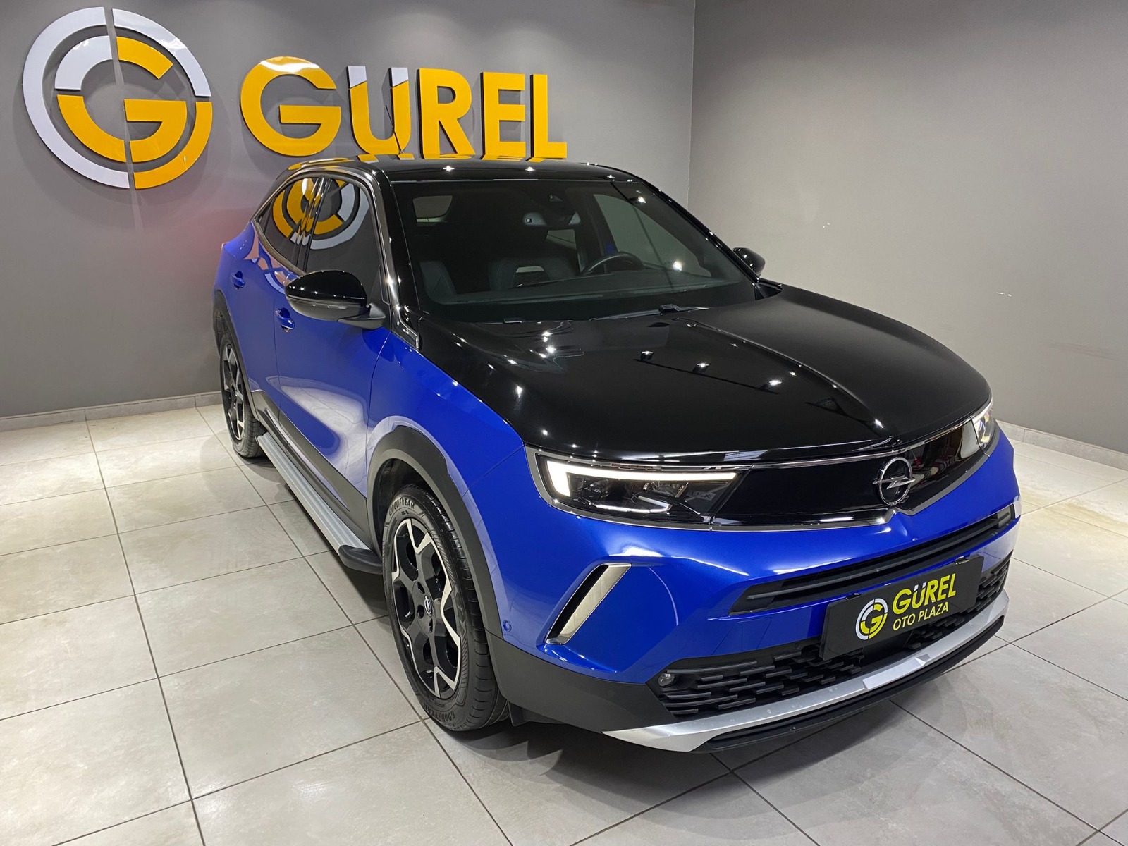 TaksitliOto.Net | 2.El Opel Mokka SUV 1.2 Turbo Ultimate Otomatik | Otomatik & Benzin | Mavi | İzmir.2el 2023 Benzin Otomatik Opel Mokka Mavi Gürel Tasarım Aksesuar Otomotiv San. Tic. Ltd. Şti.