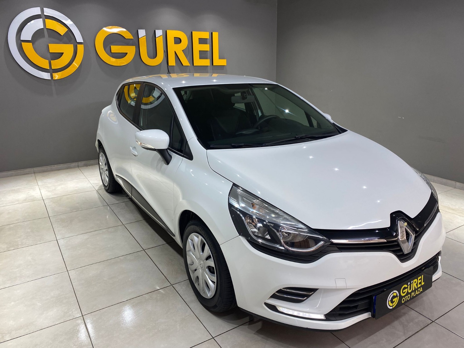TaksitliOto.Net | 2.El Renault Clio Hatchback 0.9 TCe Touch | Manuel & Benzin | Beyaz | İzmir.2el 2020 Benzin Manuel Renault Clio Beyaz Gürel Tasarım Aksesuar Otomotiv San. Tic. Ltd. Şti.
