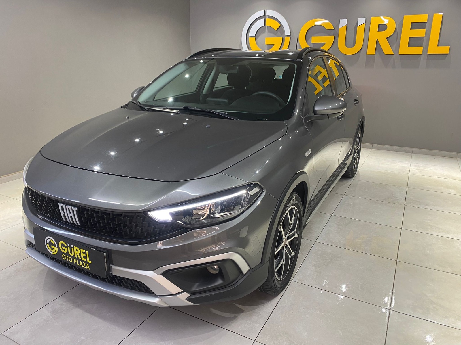 TaksitliOto.Net | 2.El Fiat Egea Cross 1.4 Fire Urban | Manuel & Benzin | Gri | İzmir.2el 2023 Benzin Manuel Fiat Egea Gri Gürel Tasarım Aksesuar Otomotiv San. Tic. Ltd. Şti.