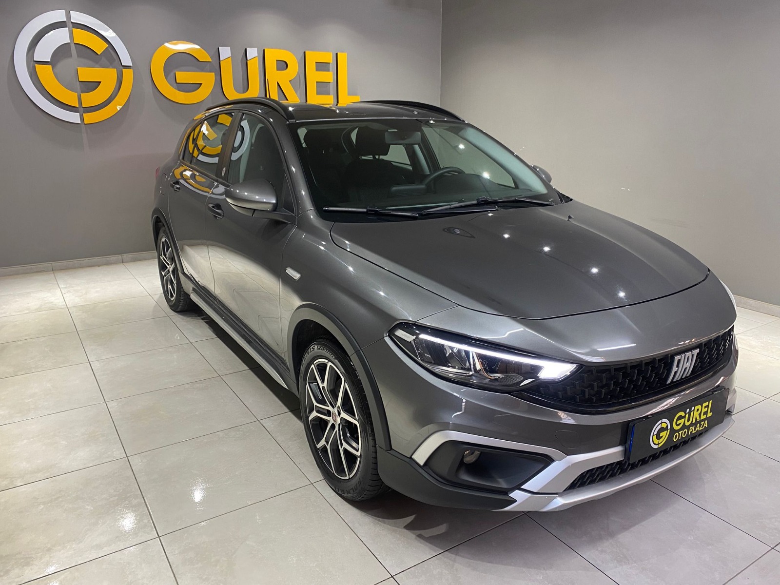TaksitliOto.Net | 2.El Fiat Egea Cross 1.4 Fire Urban | Manuel & Benzin | Gri | İzmir.2el 2023 Benzin Manuel Fiat Egea Gri Gürel Tasarım Aksesuar Otomotiv San. Tic. Ltd. Şti.