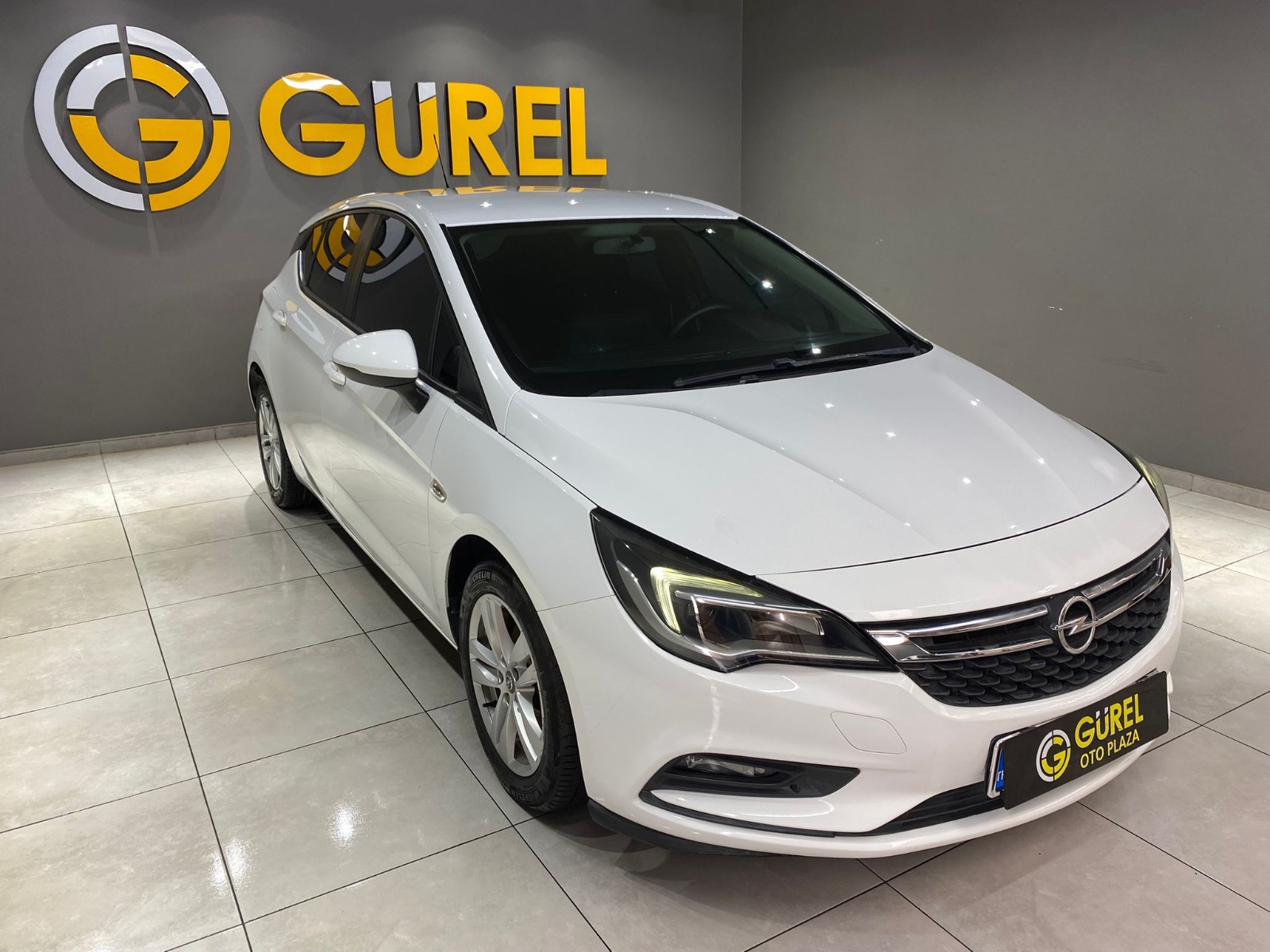 TaksitliOto.Net | 2.El Opel Astra Hatchback 1.4 Enjoy | Manuel & Benzin | Beyaz | İzmir.2el 2017 Benzin Manuel Opel Astra Beyaz Gürel Tasarım Aksesuar Otomotiv San. Tic. Ltd. Şti.