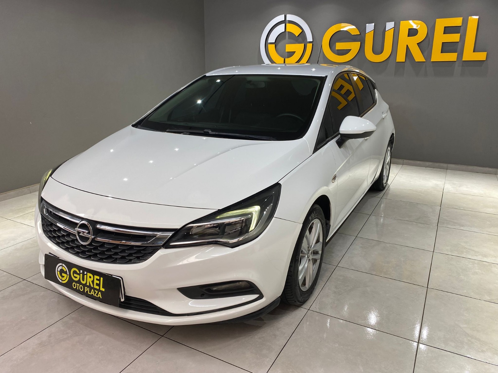 TaksitliOto.Net | 2.El Opel Astra Hatchback 1.4 Enjoy | Manuel & Benzin | Beyaz | İzmir.2el 2017 Benzin Manuel Opel Astra Beyaz Gürel Tasarım Aksesuar Otomotiv San. Tic. Ltd. Şti.