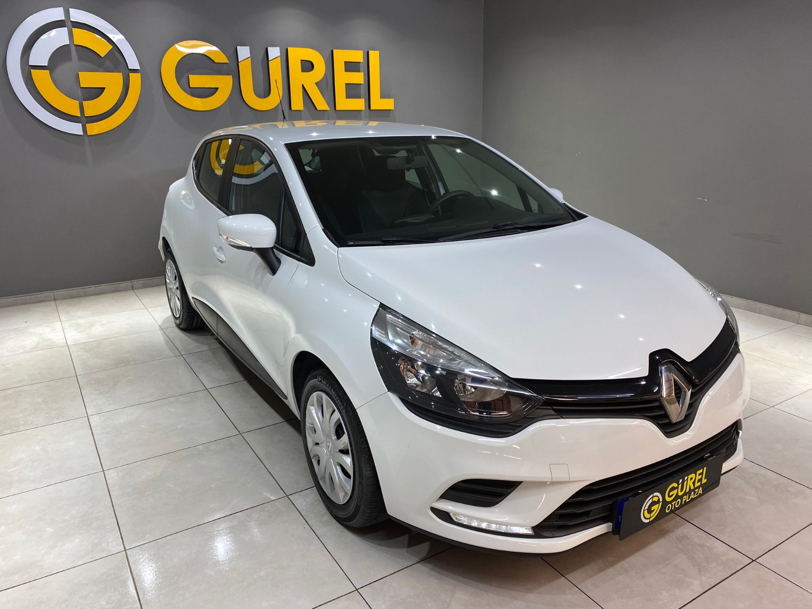 TaksitliOto.Net | 2.El Renault Clio Hatchback 0.9 TCe Joy | Manuel & Benzin | Beyaz | İzmir.2el 2020 Benzin Manuel Renault Clio Beyaz Gürel Tasarım Aksesuar Otomotiv San. Tic. Ltd. Şti.