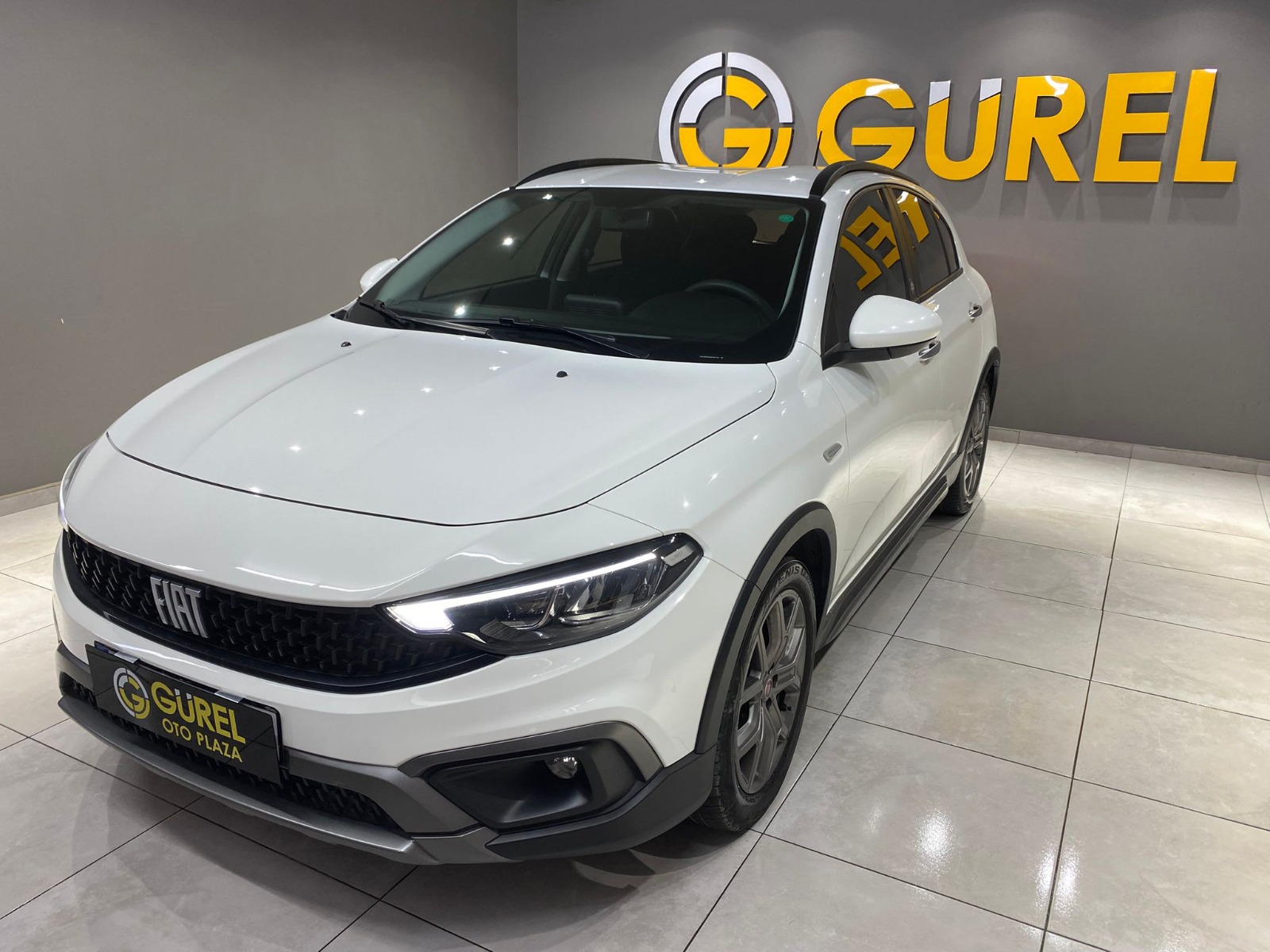 TaksitliOto.Net | 2.El Fiat Egea Cross 1.4 Fire Urban | Manuel & Benzin | Beyaz | İzmir.2el 2021 Benzin Manuel Fiat Egea Beyaz Gürel Tasarım Aksesuar Otomotiv San. Tic. Ltd. Şti.